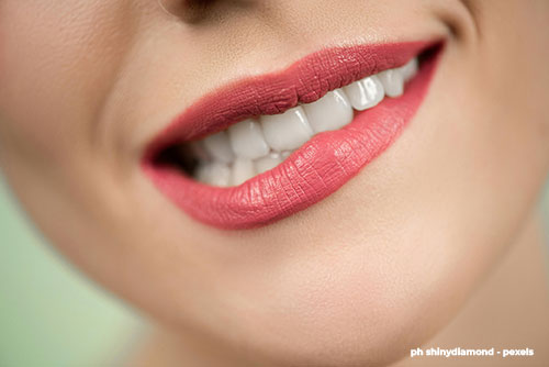 Close-up of healthy white teeth and gums representing optimal oral hygiene.